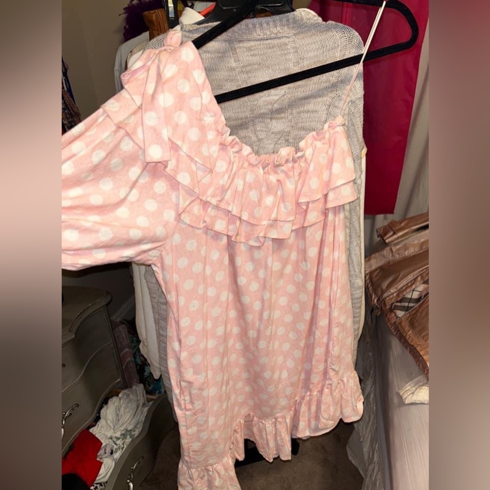 White a pink dotted dress.